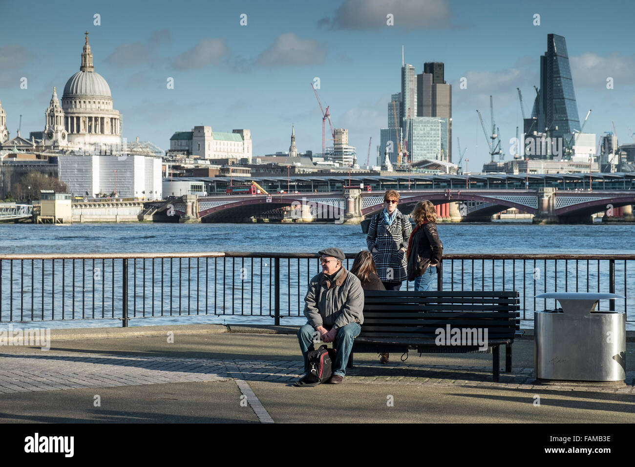 People relaxing on the South Bank in London. Stock Photo