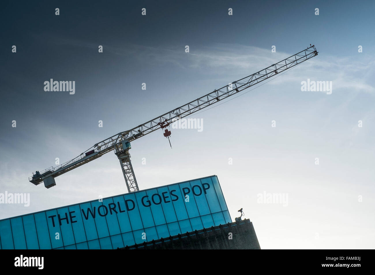 A crane towers over the Tate Modern gallery on the South Bank in London. Stock Photo