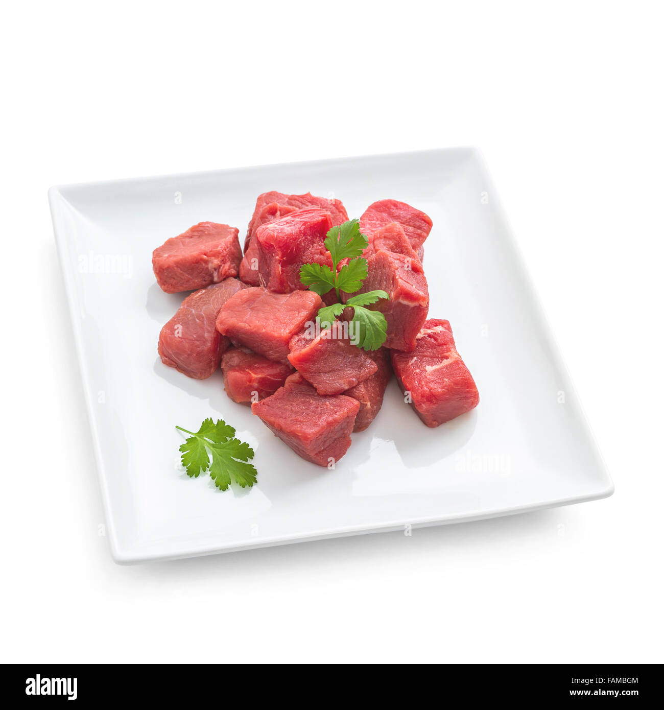 Pile of juicy beef cubes on plate, isolated top view Stock Photo Alamy