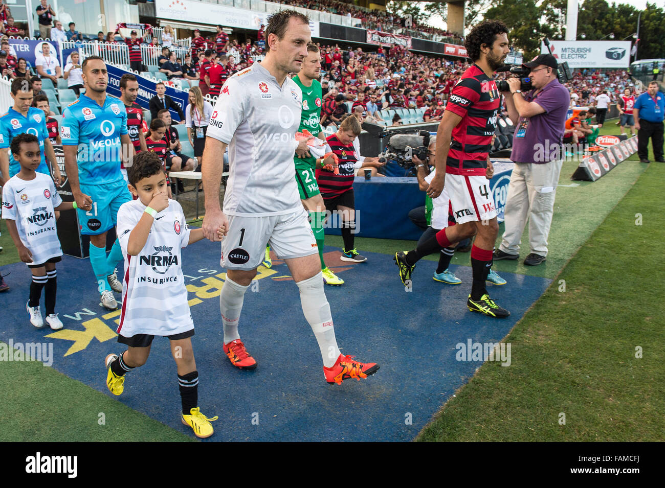 Pirtek Stadium, Sydney, Australia. 01st Jan, 2016. Hyundai A-League. Western Sydney versus Adelaide United. Adelaide captain Eugene Galekovic and Wanderers defender Nikolai Topor-Stanley lead their teams out. The game ended in a highly contested 0-0 draw. © Action Plus Sports/Alamy Live News Stock Photo