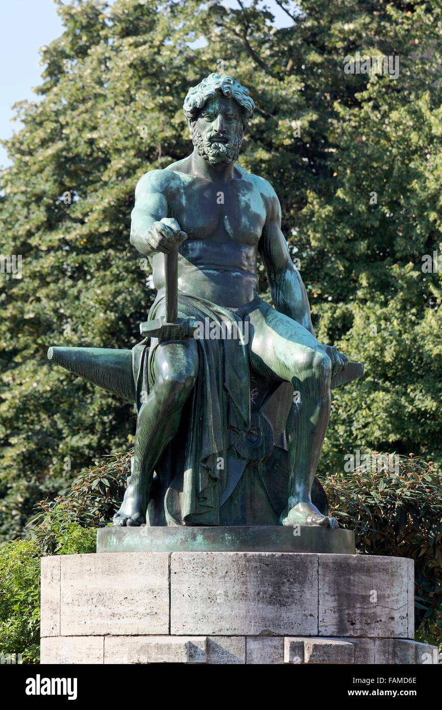 Bronze sculpture, Vulcan sitting on anvil, by Friedrich Coubillier, Industriebrunnen 1912, Düsseldorf, North Rhine-Westphalia Stock Photo