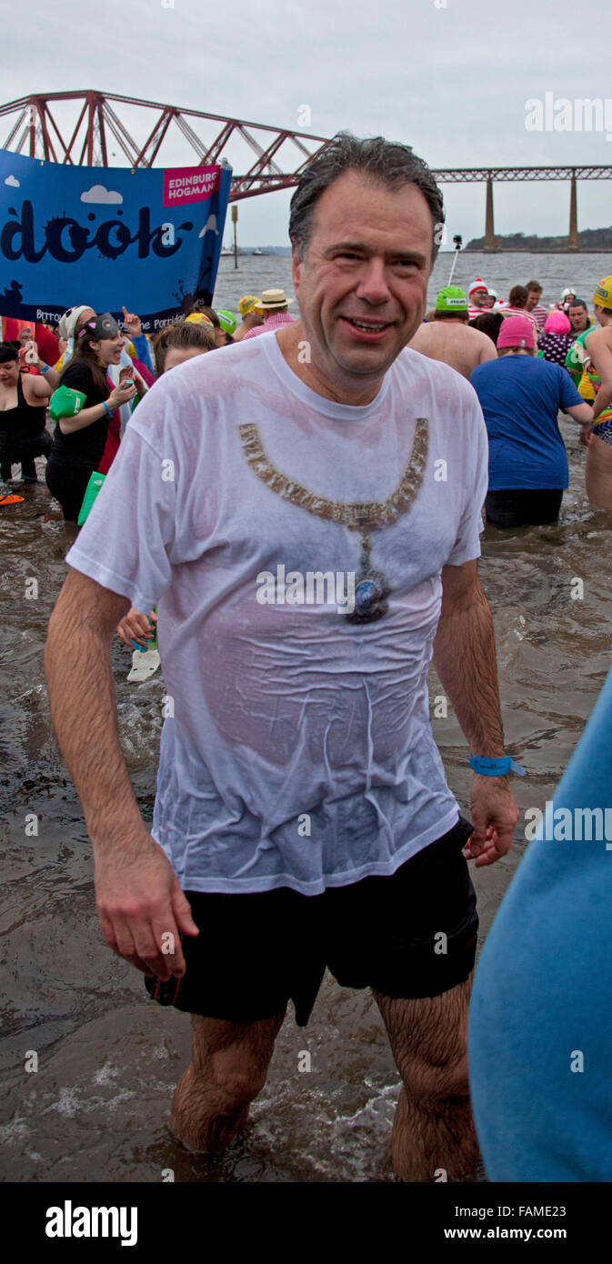 South Queensferry, Edinburgh, Scotland UK. 01 January 2016. Queensferry Loony Dook, the annual dip in the River Forth in the shadow of the world-famous Forth Rail Bridge. Takes place on the third day of the Edinburgh Hogmany New Year celebrations. The weather was fair but chilly between 2-4 degrees but this did not dampen the spirits of these hardy participants. Donald Wilson is Lord Lieutenant and Lord Provost of the City of Edinburgh Stock Photo