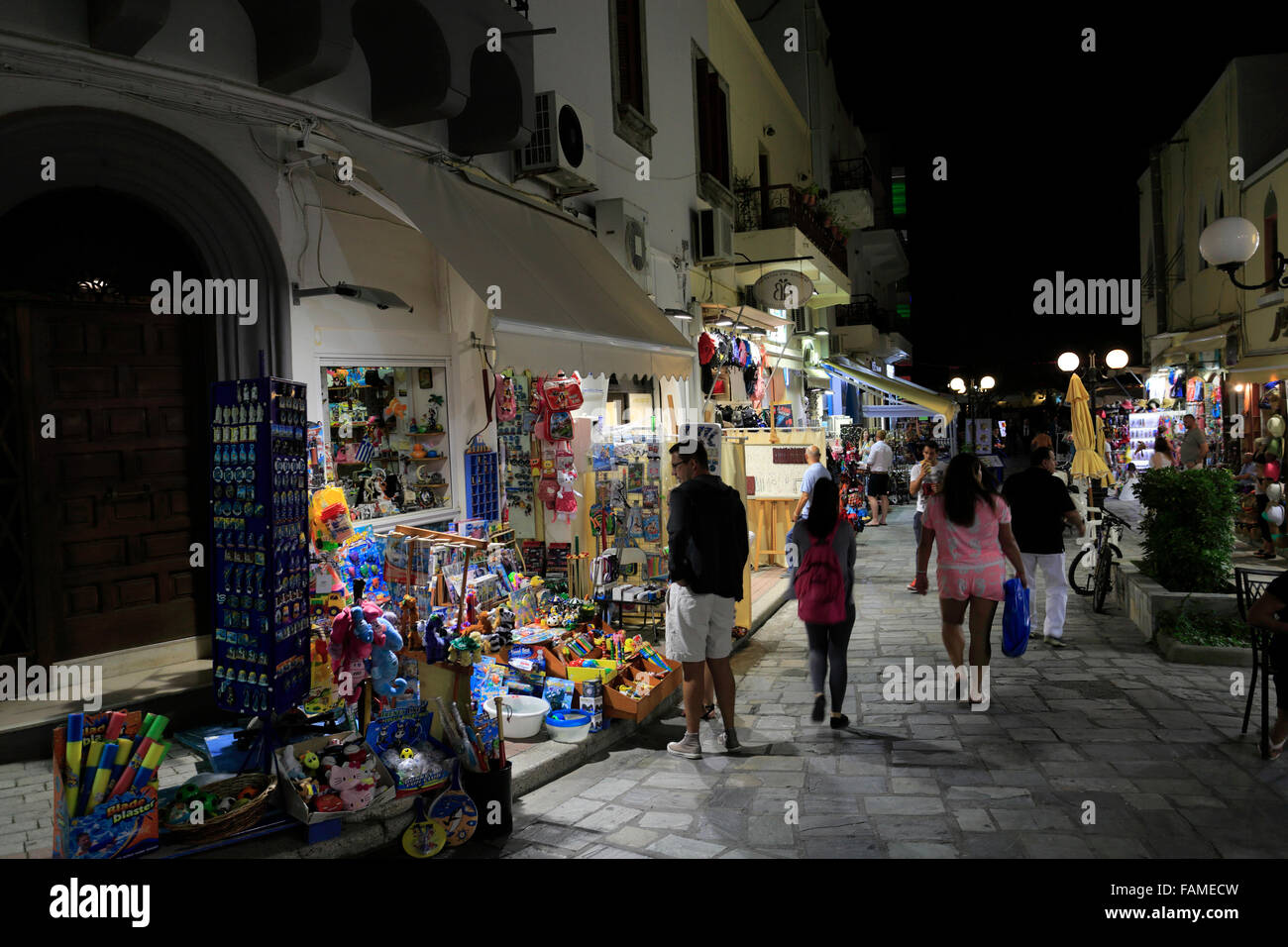 People shopping at night, Kos town, Kos Island, Dodecanese group of islands, South Aegean Sea, Greece. Stock Photo
