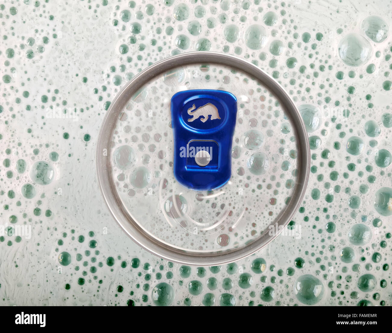 Red Bull tin can under bubbles. Red Bull is an energy drink sold by Austrian company Red Bull Stock Photo