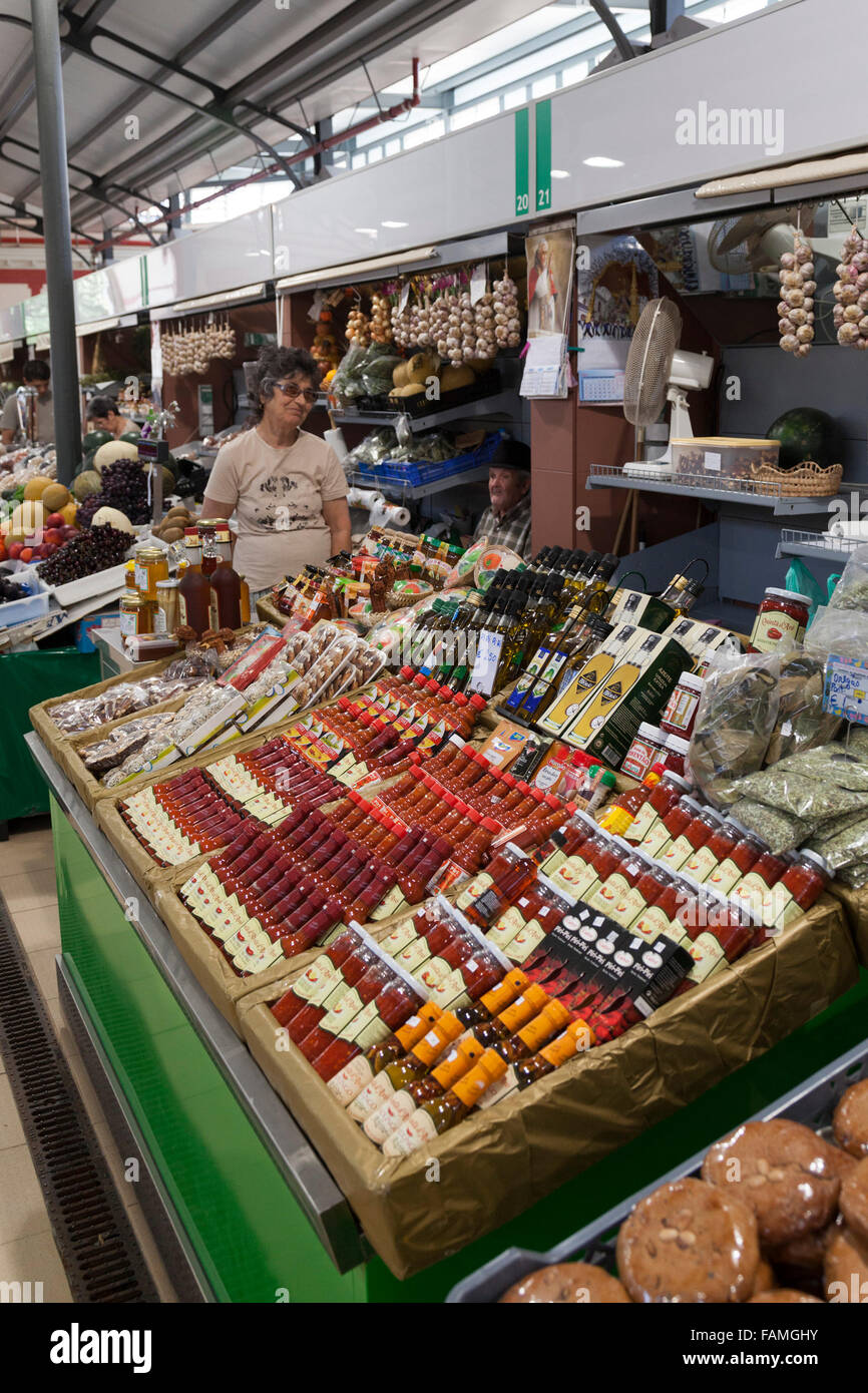 Market stall selling traditional spicy sauces in Loule, Algarve