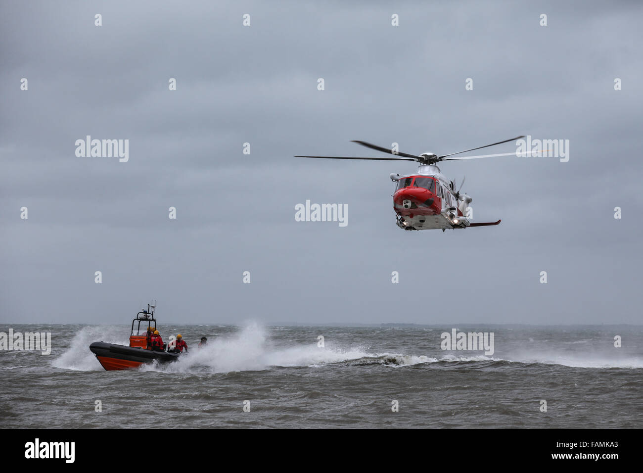 HM Coastguard Helicopter pictured during a rescue training exercise on a stormy day in the Solent Stock Photo