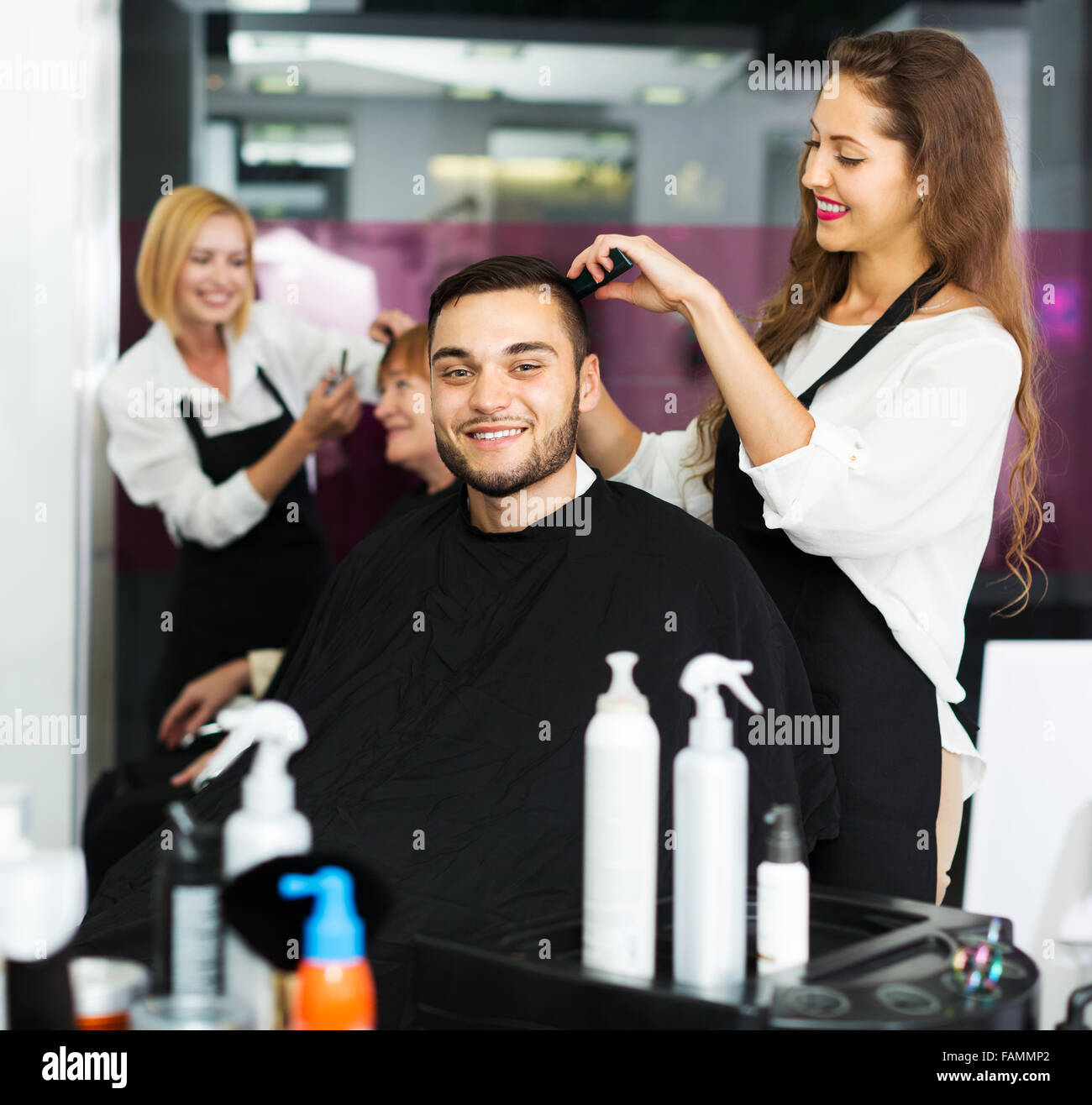 Haircutter makes the cut for man in the Stock Photo Alamy