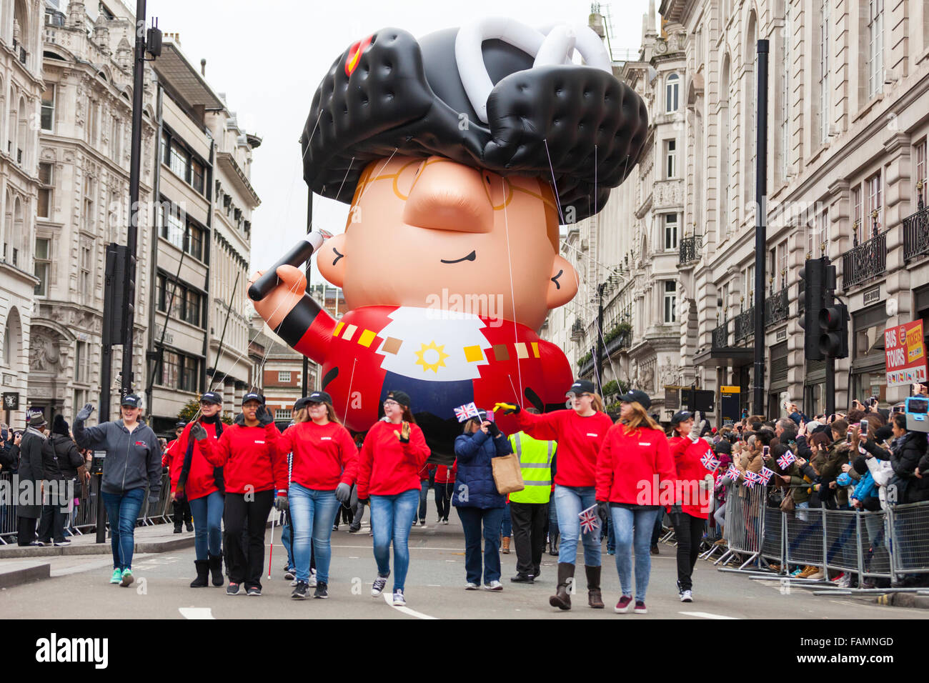 London, UK. 1st January, 2016. 'Mayor Balloon', flying at 50 feet, with students from Nebraska, at the 30th annual London's New Year's Day Parade, LNYDP 2016. The parade has more than 8,500 performers representing 20 countries world-wide, including marching bands, cheerleaders, clowns, acrobats and representatives of the London Boroughs. Credit:  Imageplotter/Alamy Live News Stock Photo