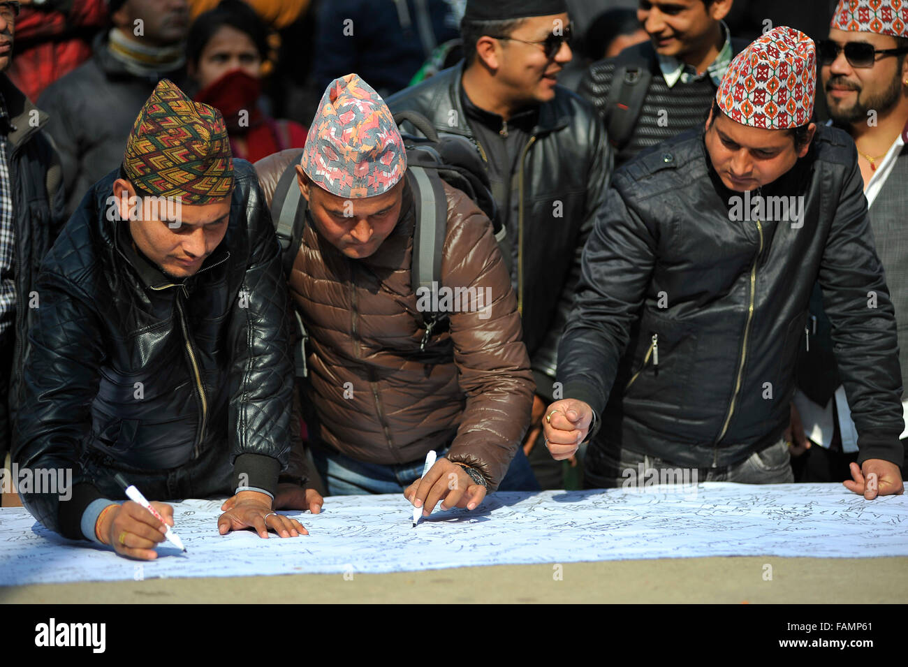 Kathmandu, Nepal. 01st Jan, 2016. Nepalese people signing on the signature campaign during the celebration of Nepalese National Nepali Traditional Topi Diwas 'Dhaka-Topi' Day at Kathmandu. © Narayan Maharjan/Pacific Press/Alamy Live News Stock Photo