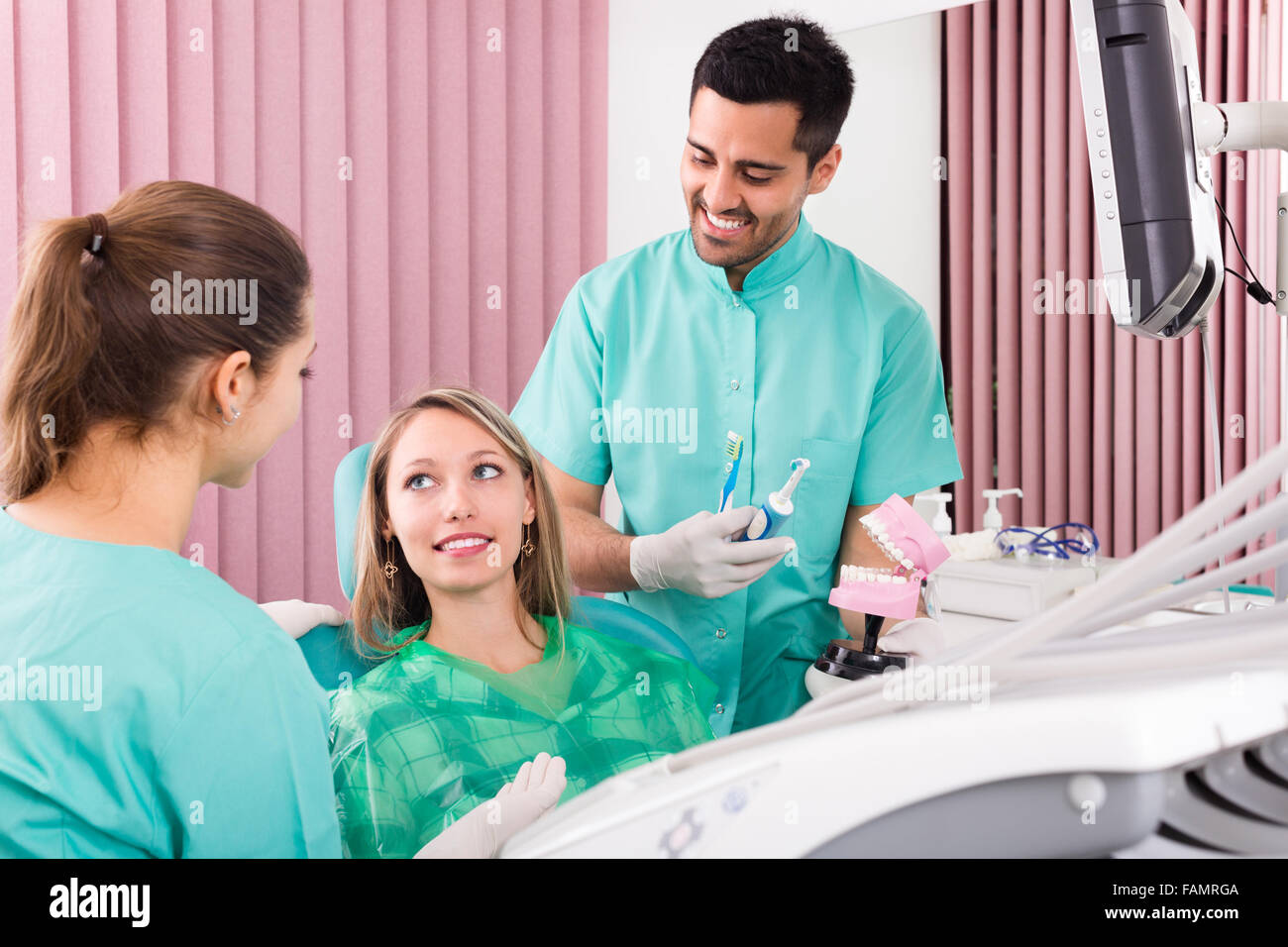 happy dentist, assistant and patient at surgery office Stock Photo Alamy