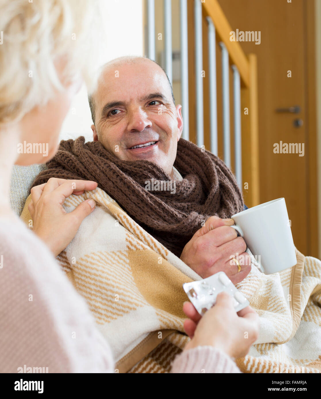 Woman giving husband cup tea hi-res stock photography and images - Alamy
