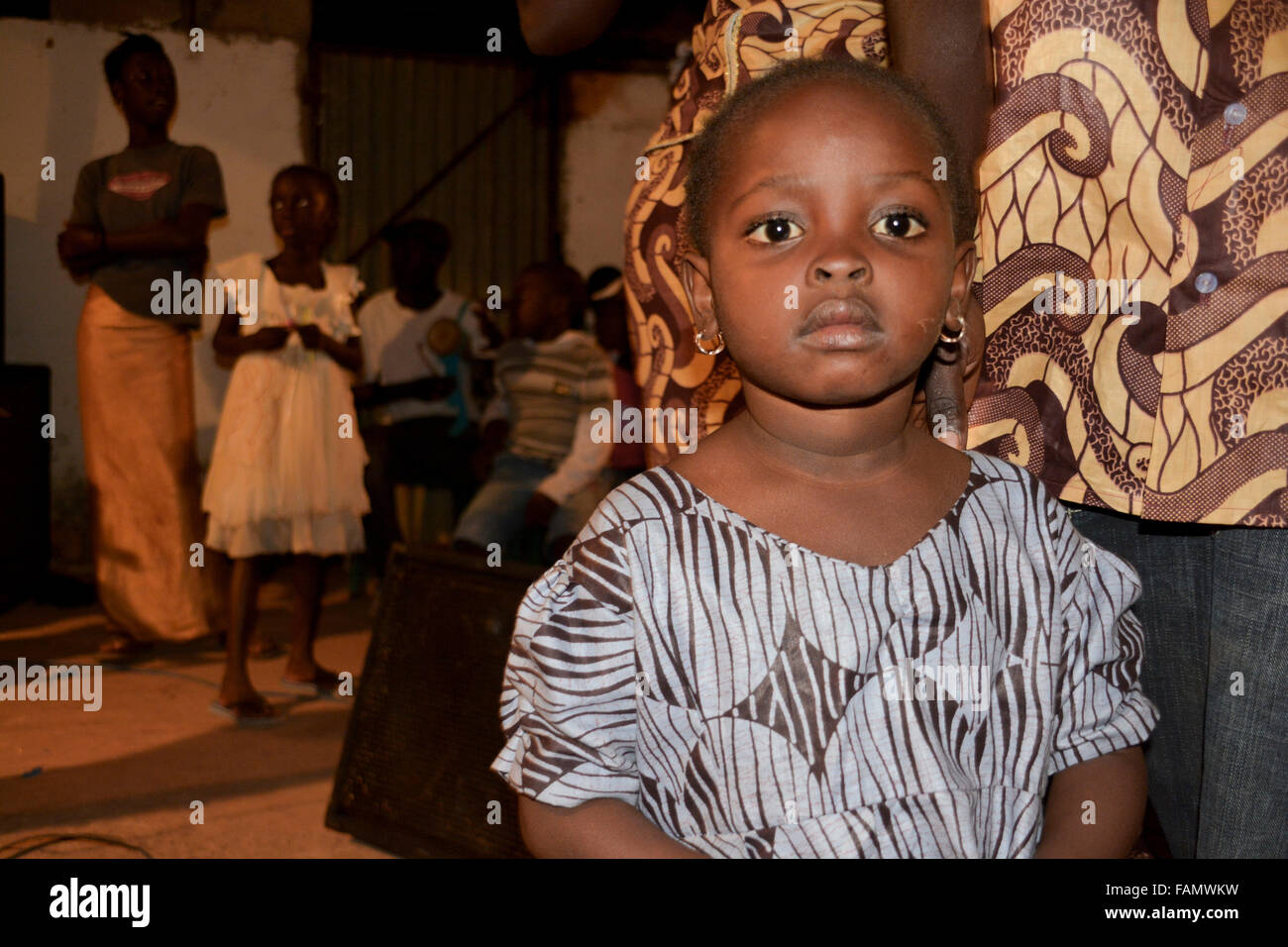 Portrait of a little African girl wearing blue outfit. Kololi, The Gambia. Stock Photo