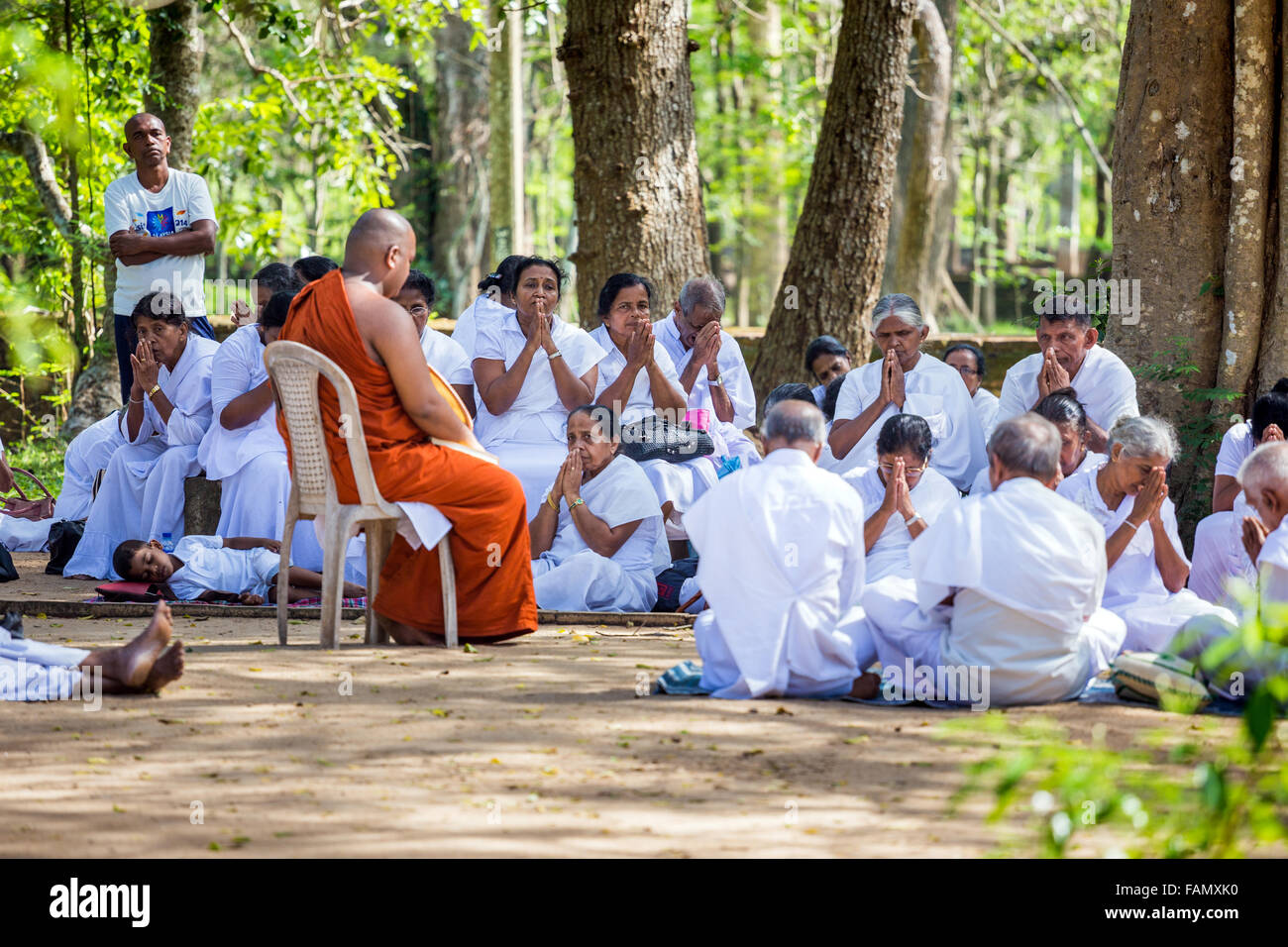 Anuradhapura, Sri Lanka. Buddhists and monk praying at the Sri Maha