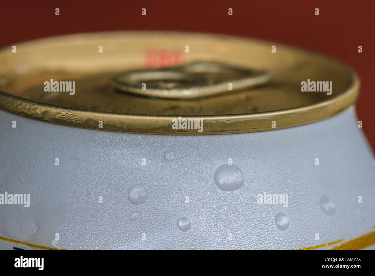 Closeup shot from the pull ring on a beverage can, opened aluminum can with water drop Stock Photo