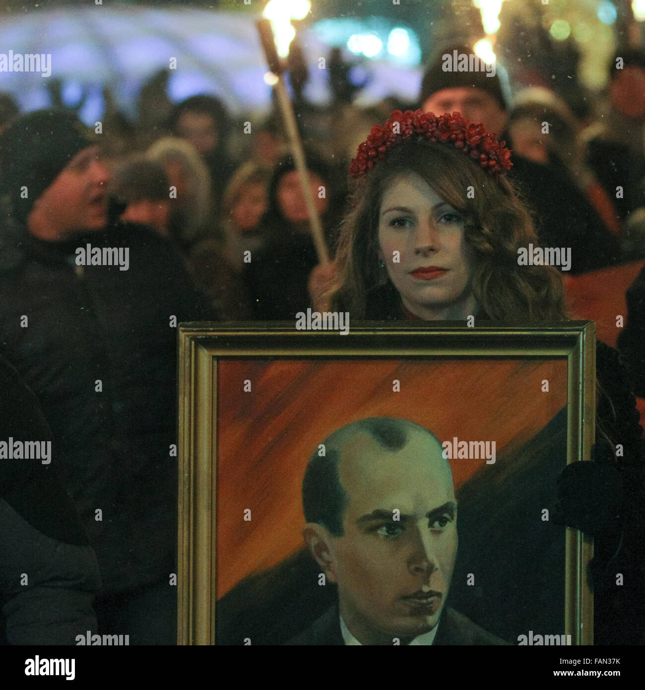 Kyiv, Ukraine. 01st Jan, 2016. Hundreds of activists and supporters of Ukrainian nationalists march with torches and flags in downtown Kiev during a rally confined to the 107th anniversary of the Ukrainian Insurgent Army head Stepan Bandera birth. Torchlights processions to honor Ukrainian nationalist leader Stepan Bandera 107th anniversary takes place in Kiev. Bandera was one of the leaders of Ukrainian national movement who headed the Ukrainian Insurgent Army. Credit:  Sergii Kharchenko/Pacific Press/Alamy Live News Stock Photo