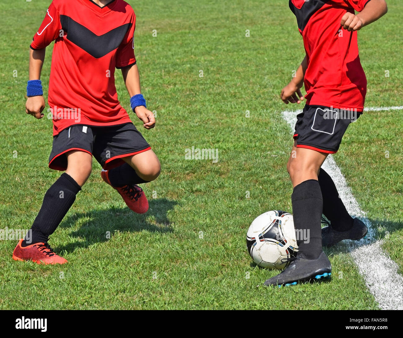 Young soccer players in action Stock Photo Alamy