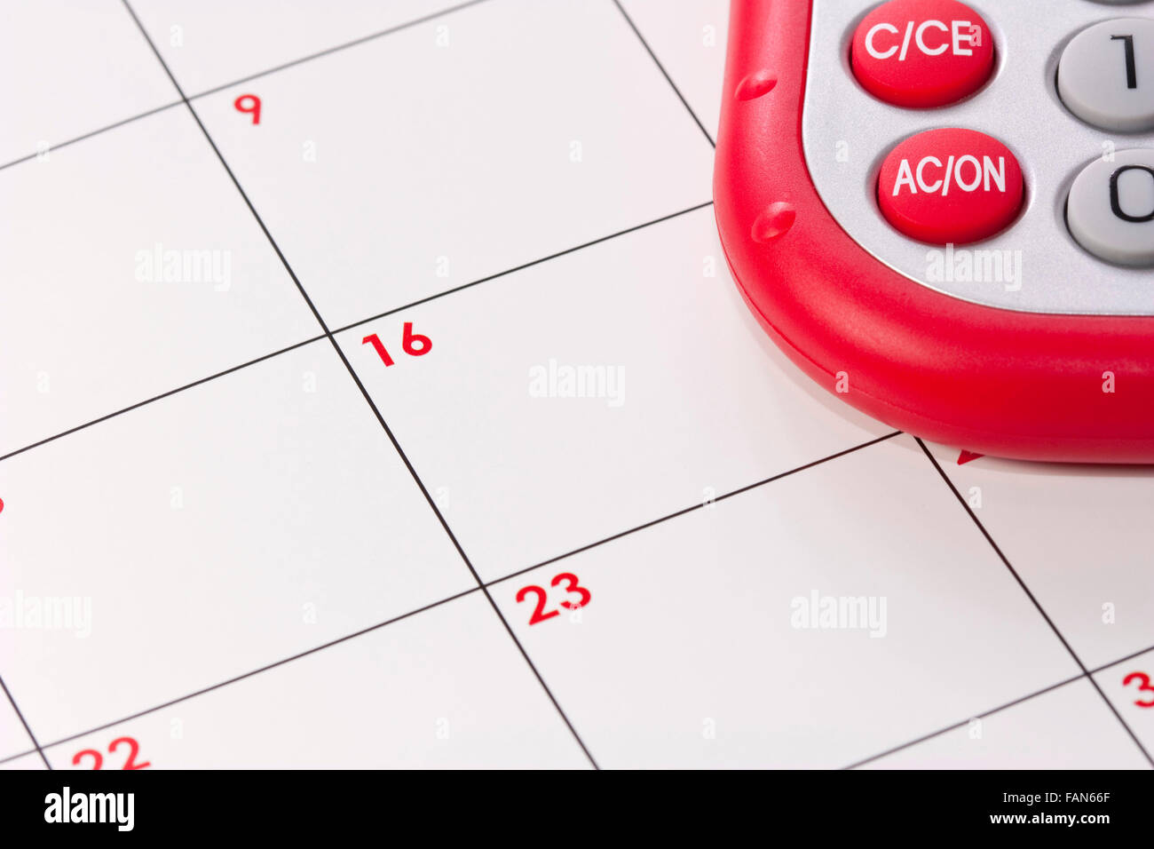 background of a calender with a calculator on top Stock Photo