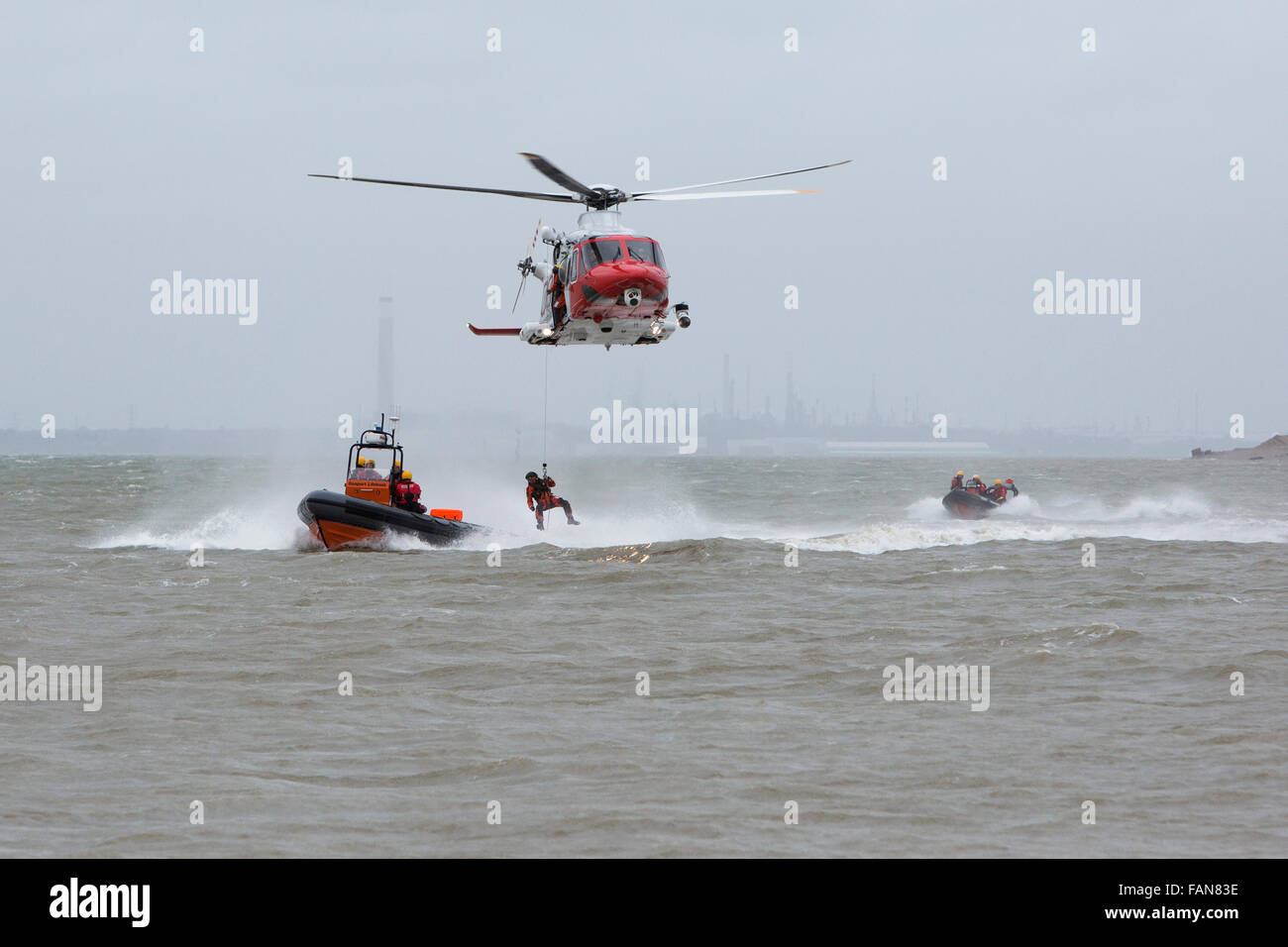 The Coastguard and RNLI pictured performing an exercise in front of crowds at the New Year's Day Swim in Gosport, Hampshire. Stock Photo