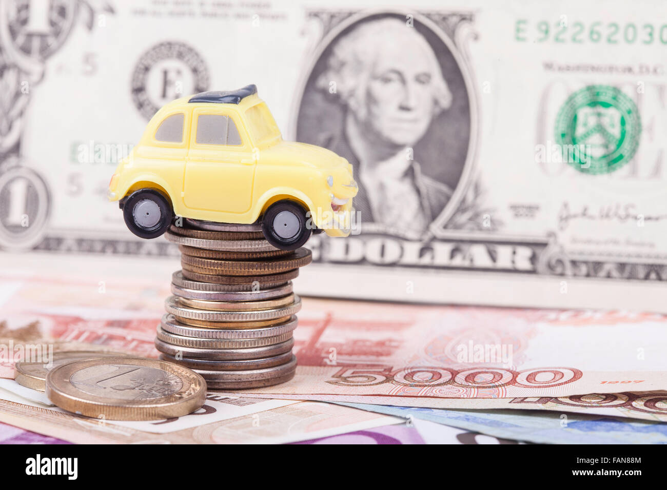 toy car and money: dollars, rubles closeup Stock Photo