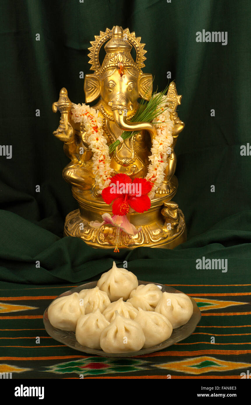 Ganesh and modak, a typical maharashtrian sweet, Pune, Maharashtra, India Stock Photo