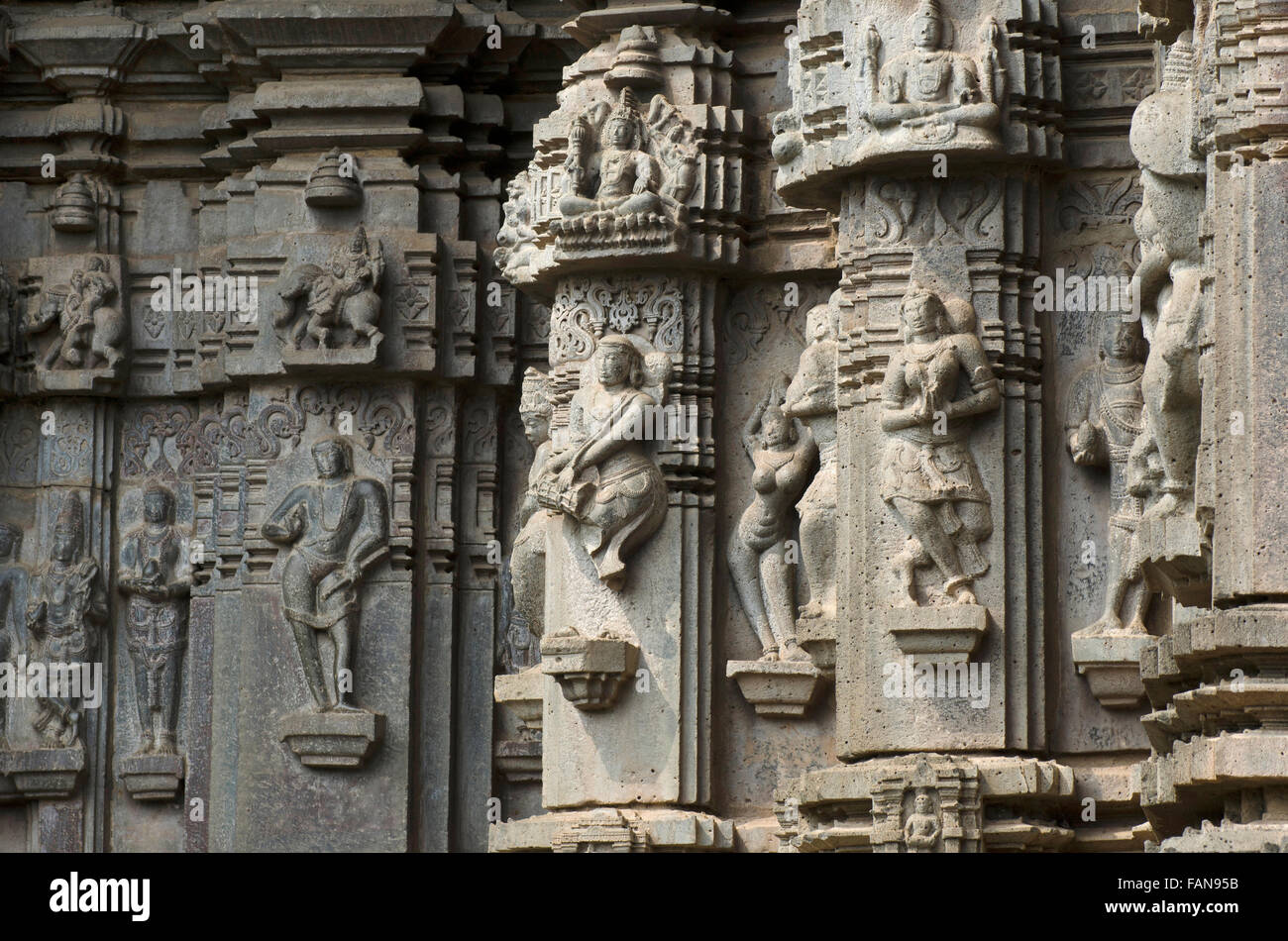 Carved exterior view  with female  figures in various poses.  Kopeshwar Temple, Khidrapur, Maharashtra, India Stock Photo