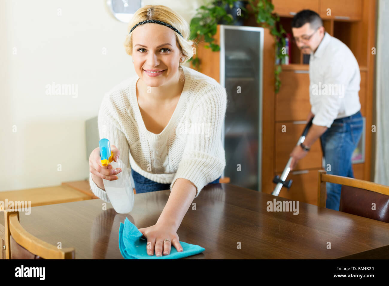 Hoovering woman smile hi-res stock photography and images - Alamy