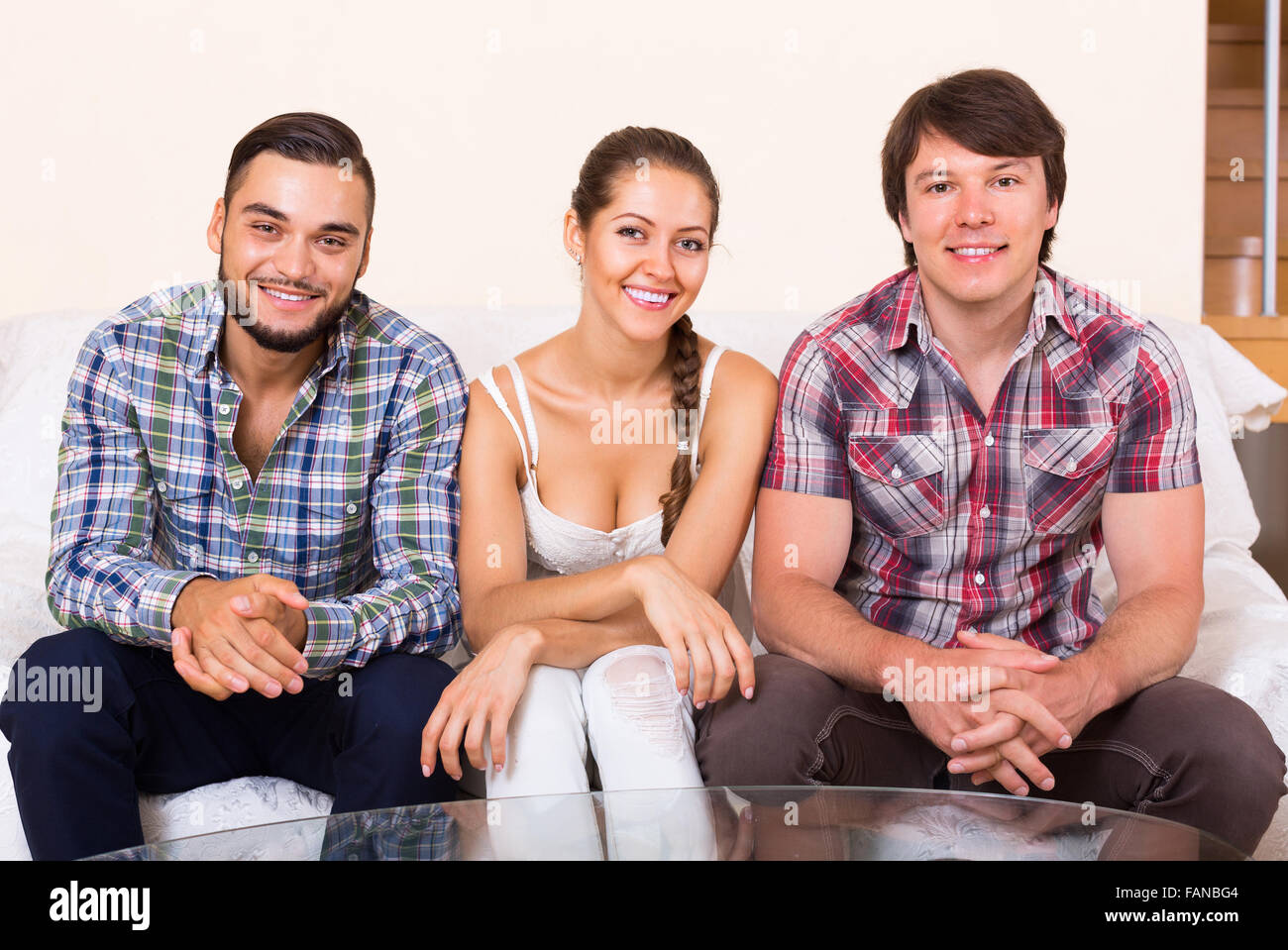 Portrait of young polygamous family posing at home Stock Photo