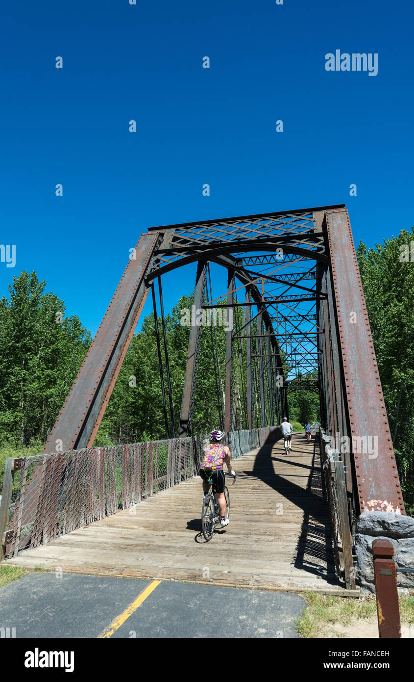 Idaho, Sun Valley, Wood River Trail System, Cold Springs Railroad Bridge built late 19C, bicyclist Stock Photo