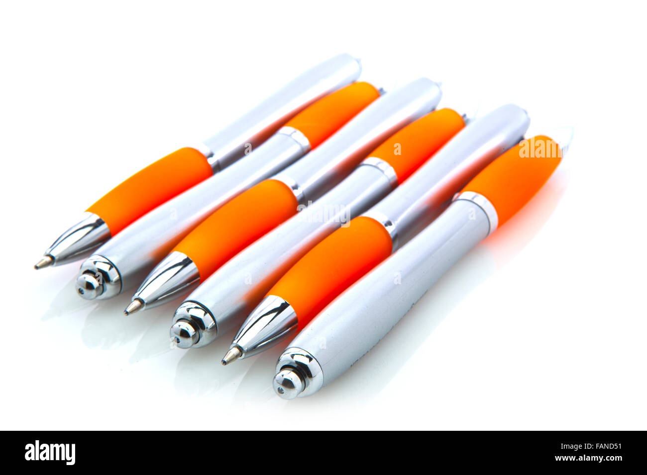 Orange and silver pens isolated on white Stock Photo