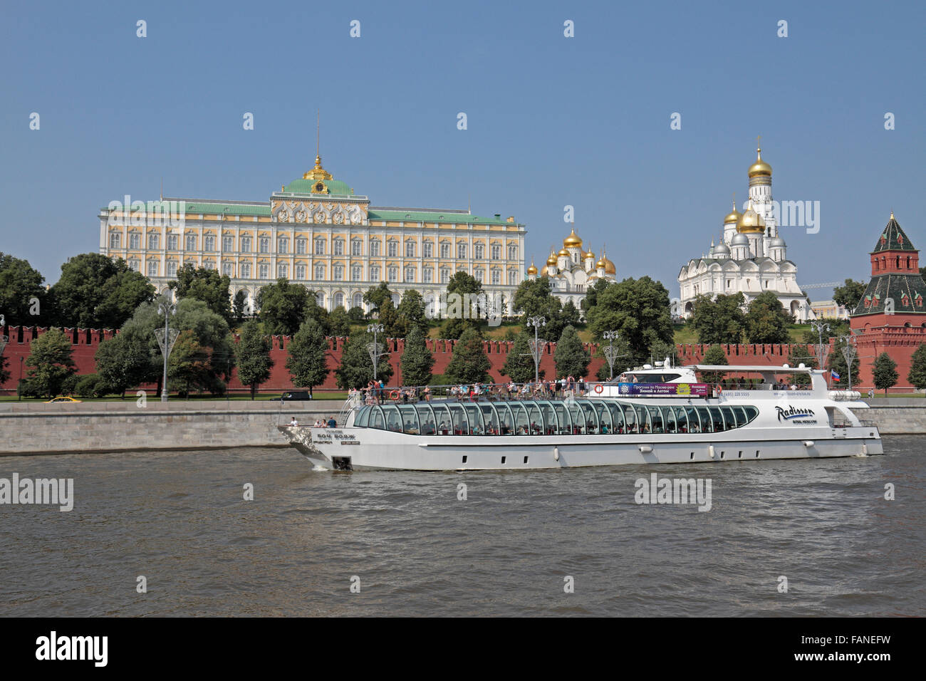 A tourist boat on the Moskva River passes the Kremlin in Moscow, Russia. Stock Photo