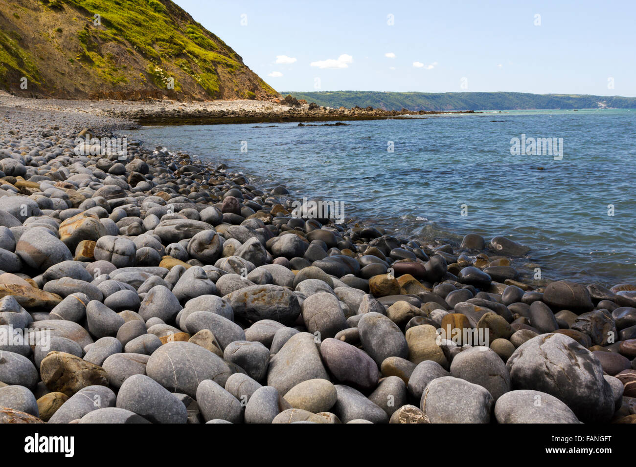 Greencliff Beach Pebble View at High Tide, Looking South West towards Bucks Mills, Devon, UK. Stock Photo