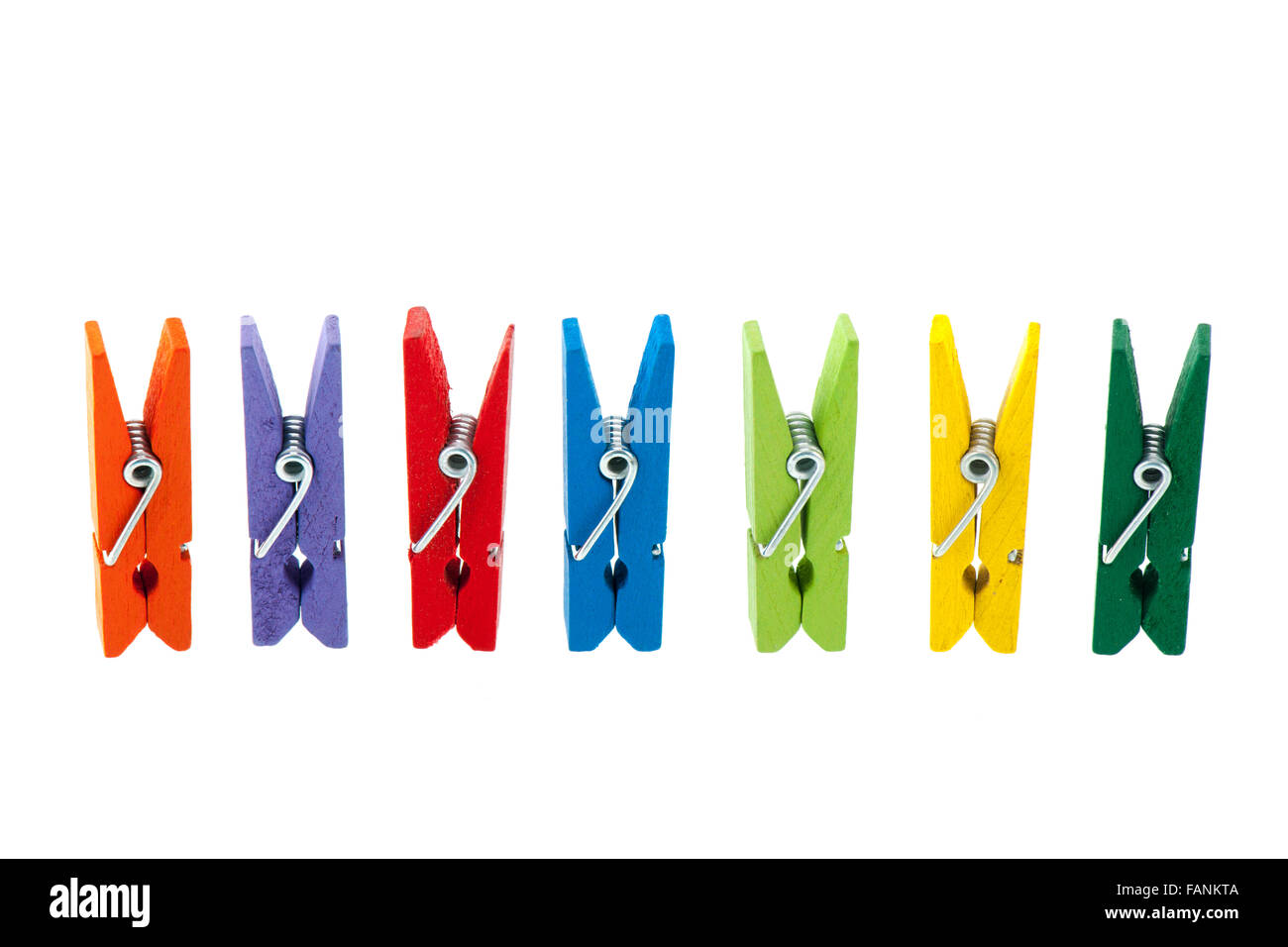 colorful wooden clothes pins isolated over white background Stock Photo