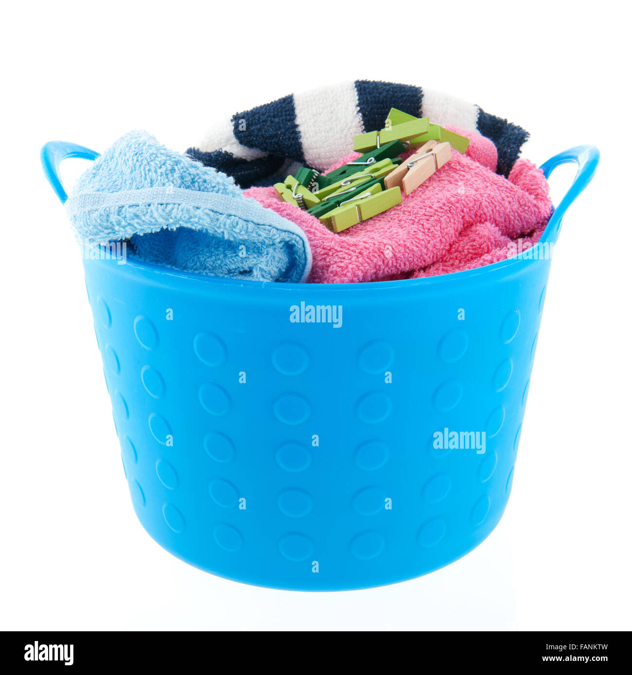 Full laundry basket with towels and clothes pins Stock Photo Alamy