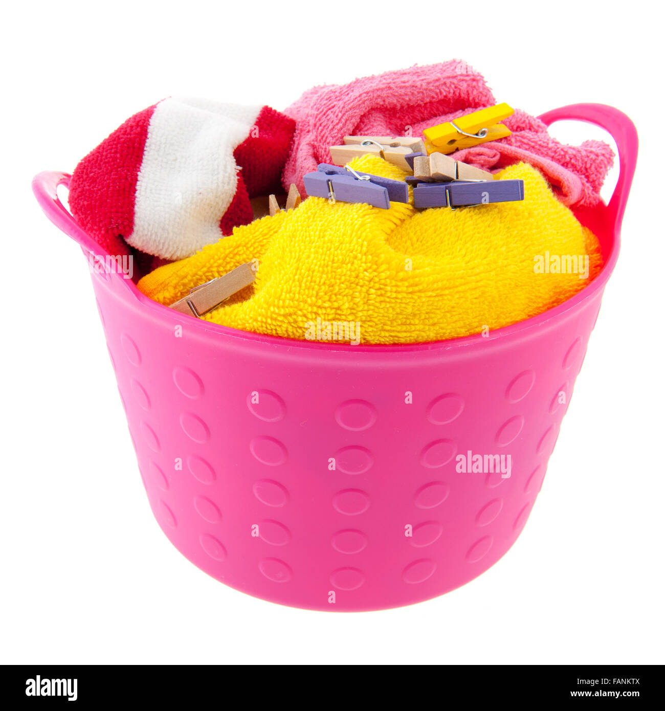 Full laundry basket with towels and clothes pins Stock Photo Alamy
