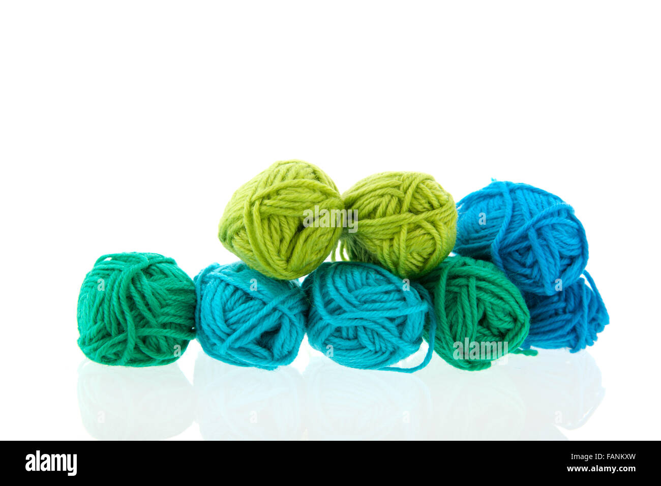 Many balls of colorful wool isolated over white background Stock Photo