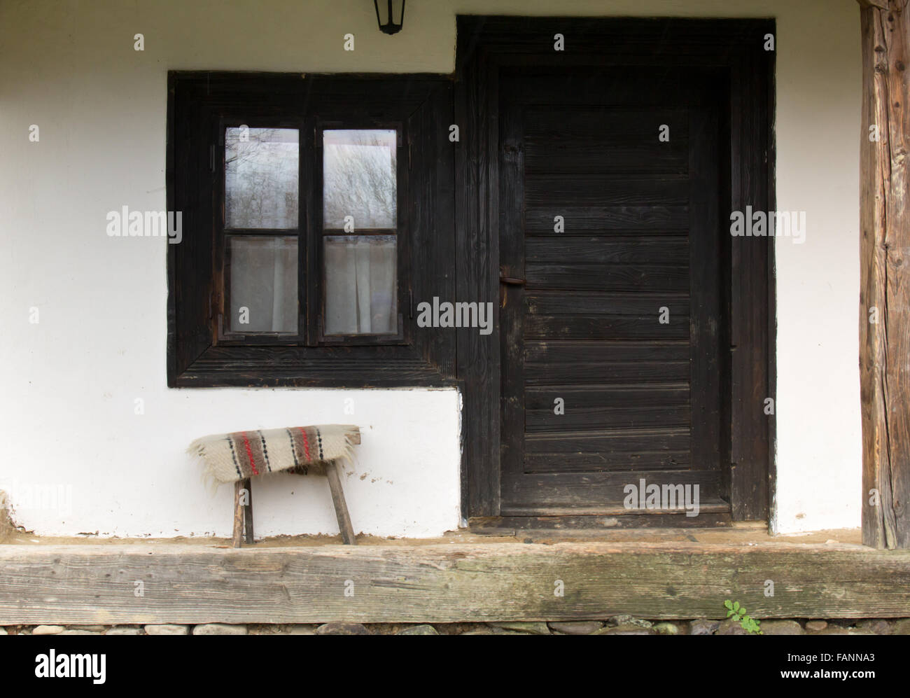 White traditional house with black wooden door and window Stock Photo