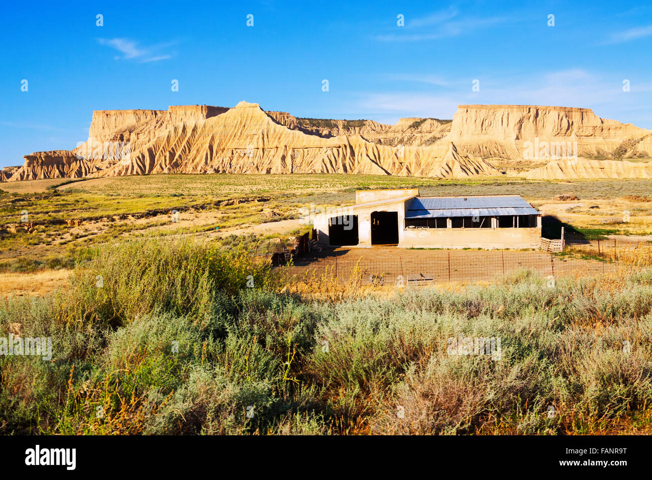Old ranch at semi-desert landscape in summer day. Navarra, Spain Stock ...