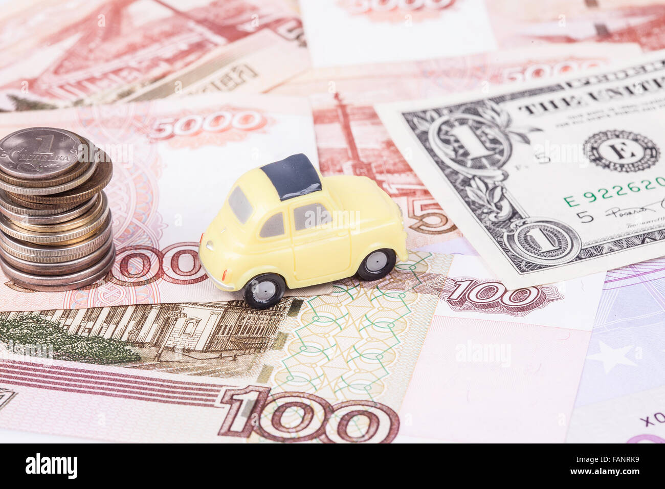 toy car and money: dollars, rubles closeup Stock Photo