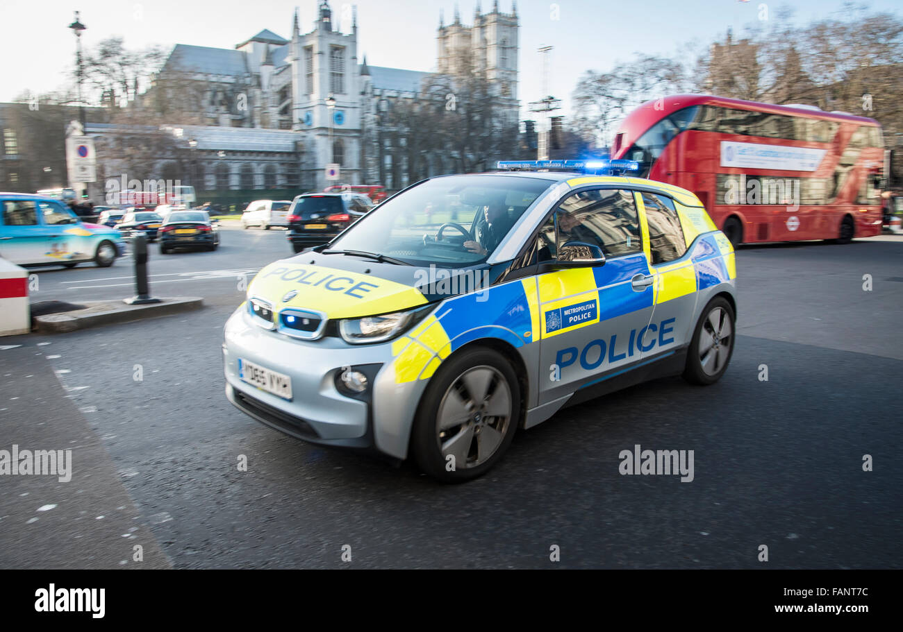 A Hybrid / Electric Bmw i3 police car speeding through London with lights flashing. Stock Photo