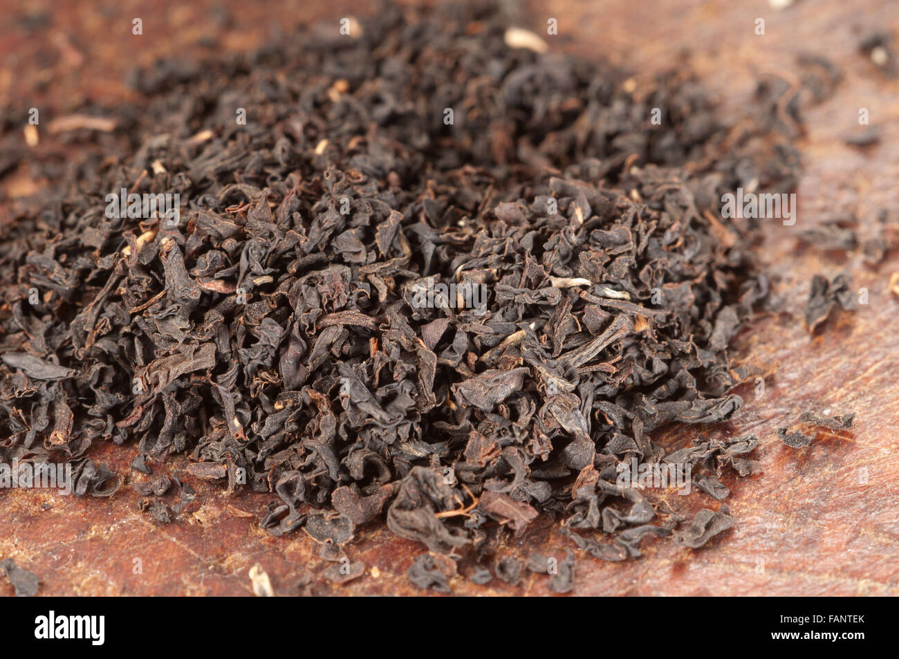 Black tea with on a board, close up shot Stock Photo