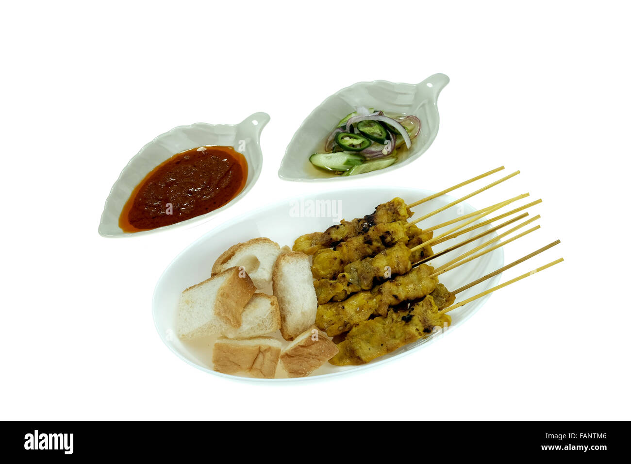 Grilled marinated pork satay with sweet and sour sauce and peanut sauce, isolated on white background Stock Photo