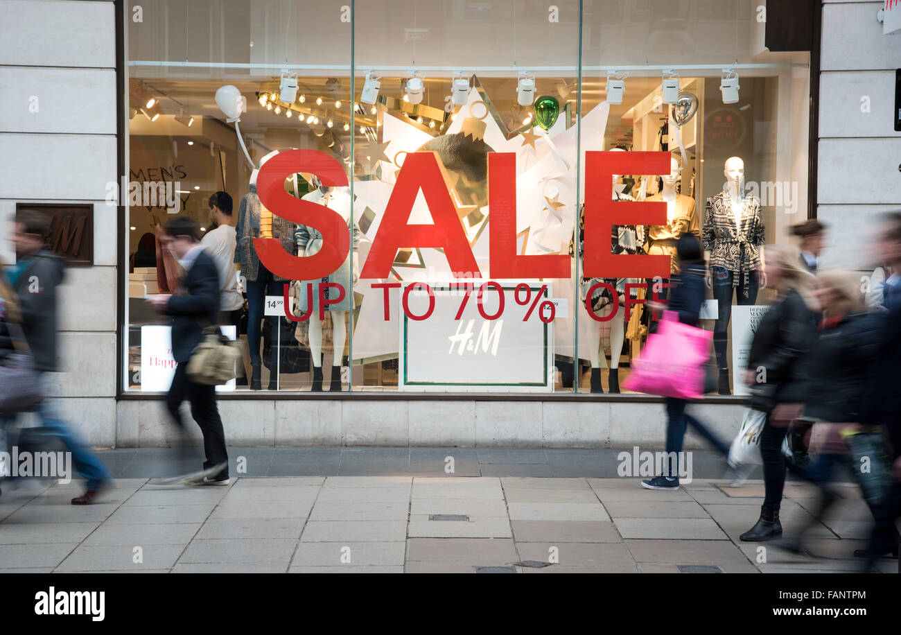 People passing sales signs in oxford street. Stock Photo