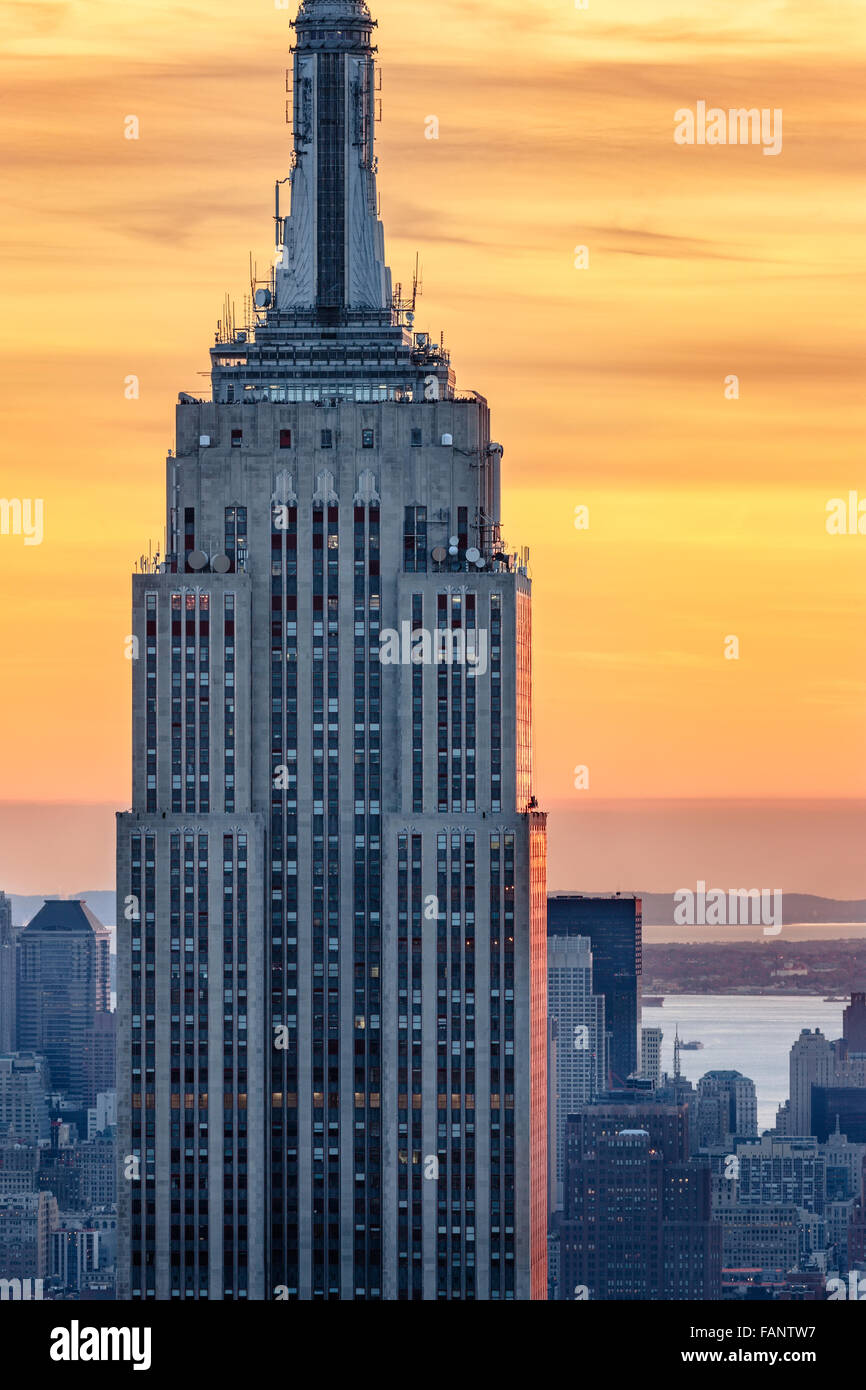 Aerial view of the top of the Empire State Building skyscraper at sunset with a fiery sky. Midtown, Manhattan, New York City Stock Photo