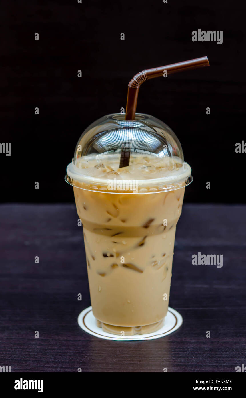 https://c8.alamy.com/comp/FANXM9/cold-coffee-drink-with-ice-on-a-table-FANXM9.jpg