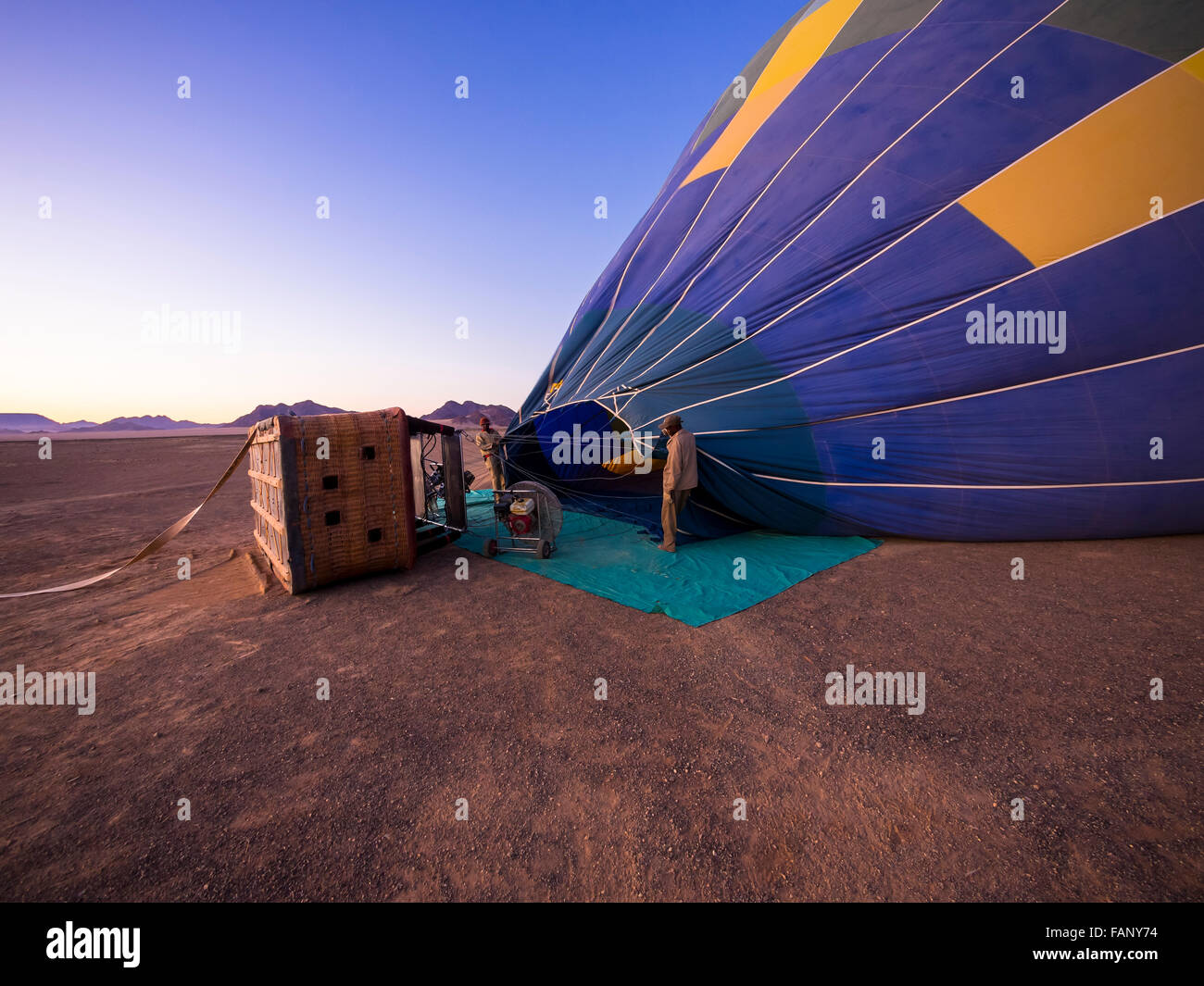 Hot air balloon being filled with air, Kulala Wilderness Reserve, Namib Desert, Tsaris Mountains, Hardap Region, Namibia Stock Photo