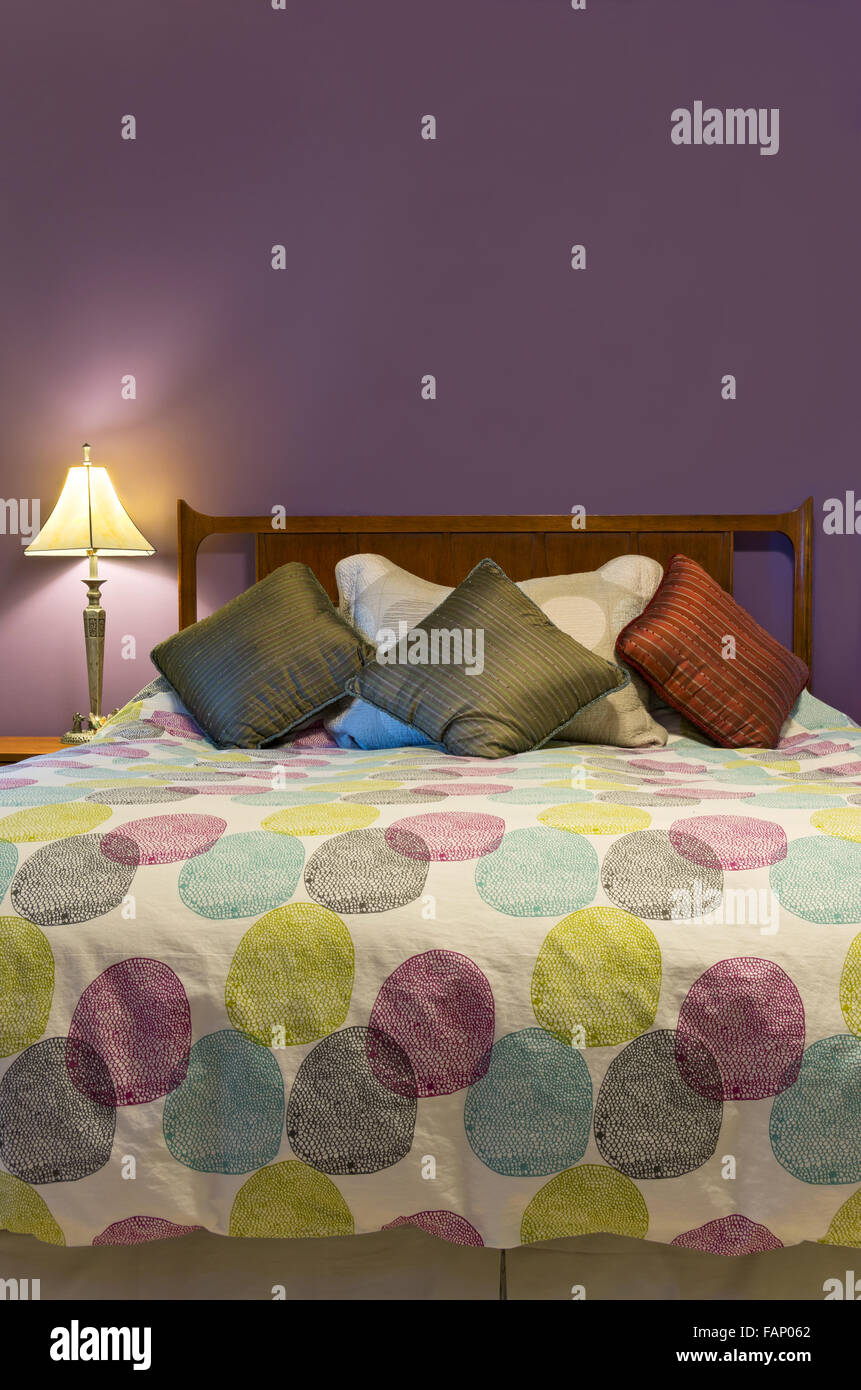 Bedroom Interior With Lamp Colorful Pillows And Comforter