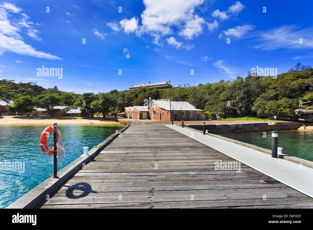 Wooden pier and brick buildings of Sydney's QUarantine station which is a historic museum of colonisation of Australia Stock Photo