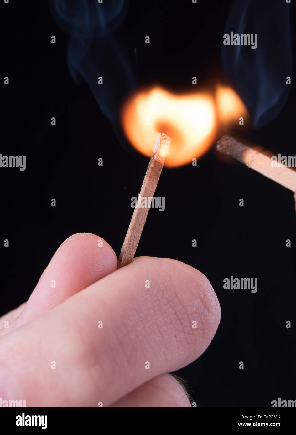 match being lit by another match Stock Photo Alamy