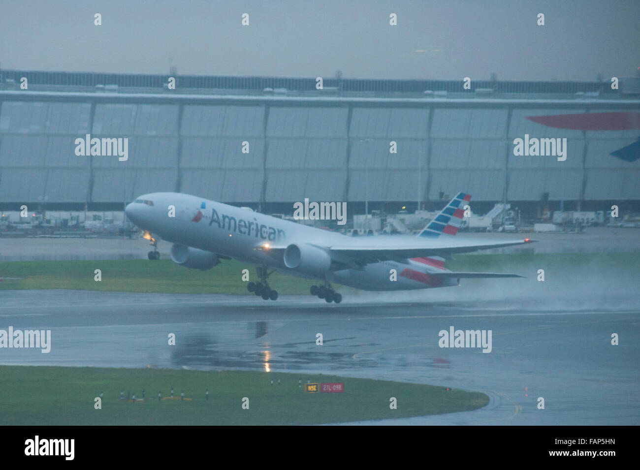 London, UK, 02 January 2016, Planes continue to take off in heavy rain and mist at Heathrow Airport as storm Frank causes floods in the north of England. Credit:  JOHNNY ARMSTEAD/Alamy Live News Stock Photo