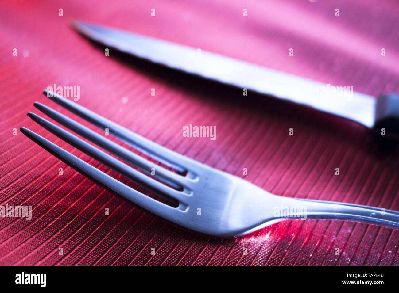 Knife and fork on dinner table place setting in restaurant wedding